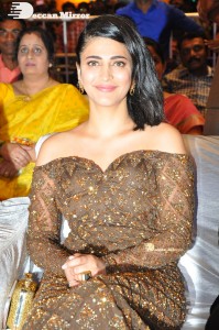 Shruti Haasan in a golden brown dress at a movie function