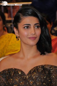 Shruti Haasan in a golden brown dress at a movie function
