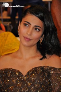 Shruti Haasan in a golden brown dress at a movie function