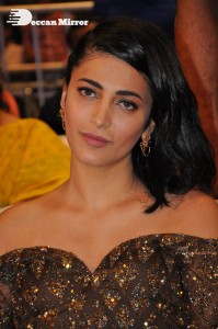 Shruti Haasan in a golden brown dress at a movie function