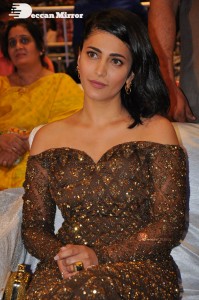 Shruti Haasan in a golden brown dress at a movie function
