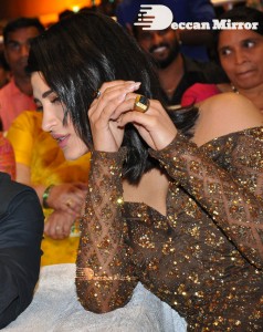 Shruti Haasan in a golden brown dress at a movie function
