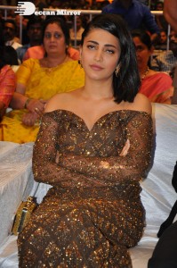 Shruti Haasan in a golden brown dress at a movie function