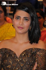 Shruti Haasan in a golden brown dress at a movie function