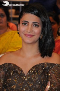 Shruti Haasan in a golden brown dress at a movie function