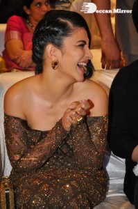 Shruti Haasan in a golden brown dress at a movie function