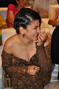Shruti Haasan in a golden brown dress at a movie function