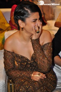 Shruti Haasan in a golden brown dress at a movie function