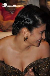 Shruti Haasan in a golden brown dress at a movie function