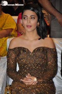 Shruti Haasan in a golden brown dress at a movie function