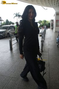 Indian actress Shruti Haasan stylish in a black dress at mumbai airport