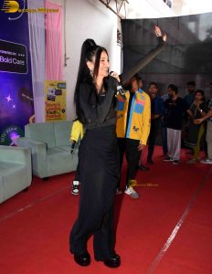 actress Shruti Haasan ravishing in a black dress speaking at an event