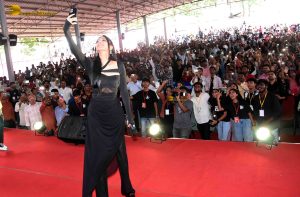 actress Shruti Haasan ravishing in a black dress speaking at an event