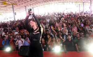 actress Shruti Haasan ravishing in a black dress speaking at an event