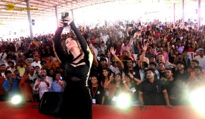 actress Shruti Haasan ravishing in a black dress speaking at an event