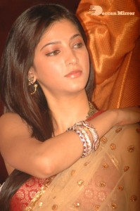 Shruti Haasan in a golden color saree