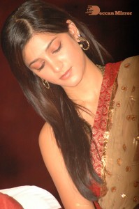 Shruti Haasan in a golden color saree