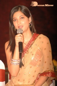 Shruti Haasan in a golden color saree