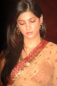 Shruti Haasan in a golden color saree