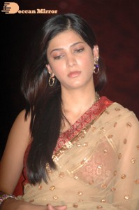 Shruti Haasan in a golden color saree