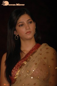 Shruti Haasan in a golden color saree