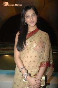 Shruti Haasan in a golden color saree