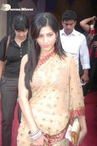 Shruti Haasan in a golden color saree
