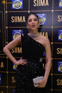 actress Shruti Haasan stylish in a black dress and poses for pictures at at event