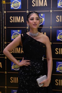actress Shruti Haasan stylish in a black dress and poses for pictures at at event