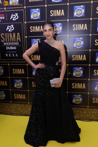 actress Shruti Haasan stylish in a black dress and poses for pictures at at event