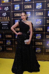 actress Shruti Haasan stylish in a black dress and poses for pictures at at event