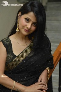 Actress Shubhangi Pant posing in a Black Saree for a Photoshoot