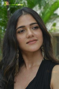 Actress Simran Choudhary poses in a Black Dress for a Photoshoot