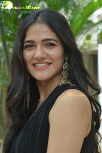 Actress Simran Choudhary poses in a Black Dress for a Photoshoot