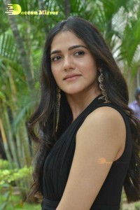 Actress Simran Choudhary poses in a Black Dress for a Photoshoot