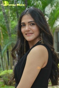 Actress Simran Choudhary poses in a Black Dress for a Photoshoot