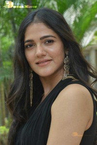 Actress Simran Choudhary poses in a Black Dress for a Photoshoot