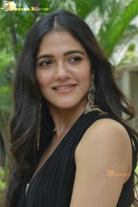 Actress Simran Choudhary poses in a Black Dress for a Photoshoot