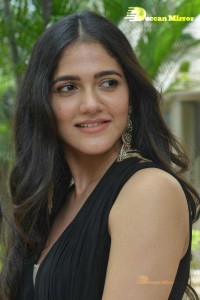 Actress Simran Choudhary poses in a Black Dress for a Photoshoot