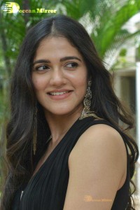 Actress Simran Choudhary poses in a Black Dress for a Photoshoot