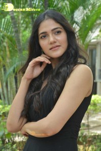 Actress Simran Choudhary poses in a Black Dress for a Photoshoot