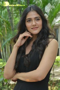 Actress Simran Choudhary poses in a Black Dress for a Photoshoot