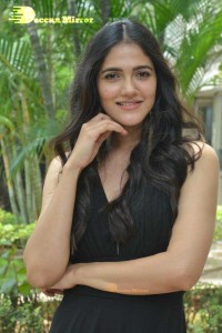 Actress Simran Choudhary poses in a Black Dress for a Photoshoot