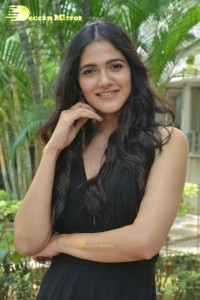 Actress Simran Choudhary poses in a Black Dress for a Photoshoot