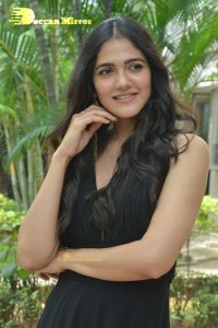 Actress Simran Choudhary poses in a Black Dress for a Photoshoot