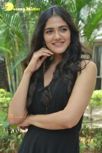 Actress Simran Choudhary poses in a Black Dress for a Photoshoot