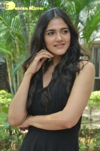 Actress Simran Choudhary poses in a Black Dress for a Photoshoot