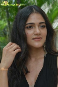 Actress Simran Choudhary poses in a Black Dress for a Photoshoot