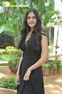 Actress Simran Choudhary poses in a Black Dress for a Photoshoot