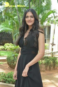Actress Simran Choudhary poses in a Black Dress for a Photoshoot